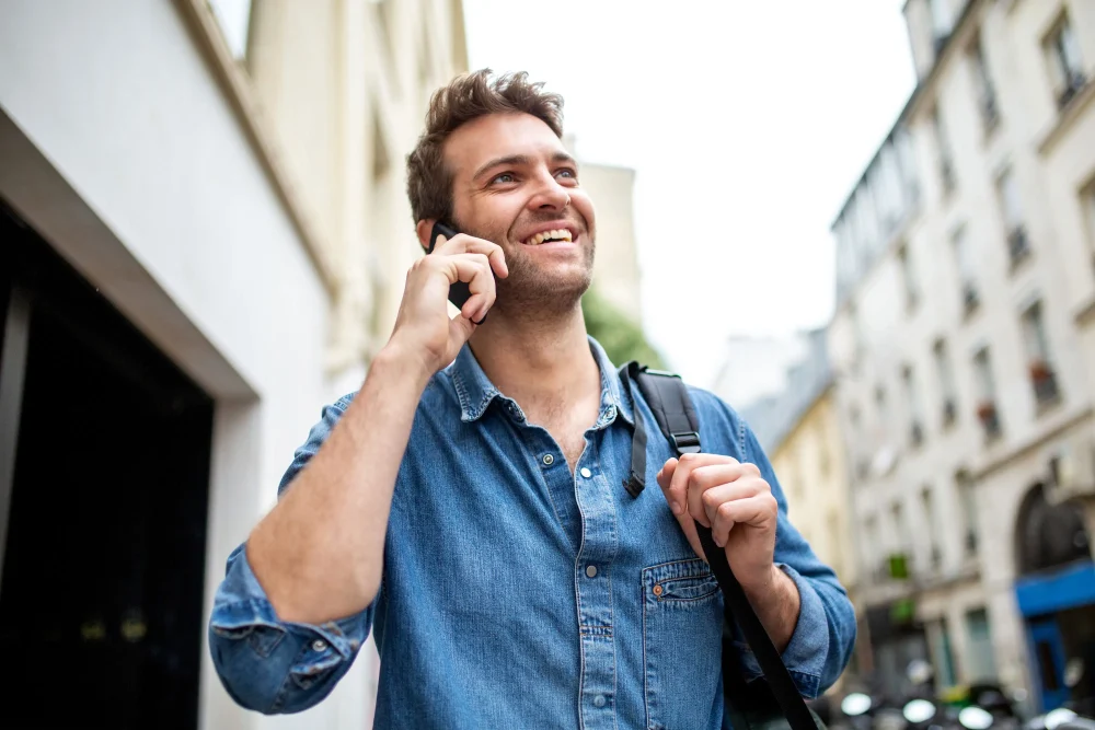 Man talking with mobile phone in city