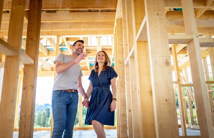 Couple visiting house under construction