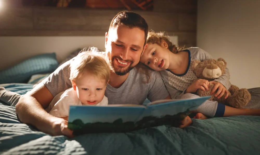 evening family reading. father reads children . book before going to bed