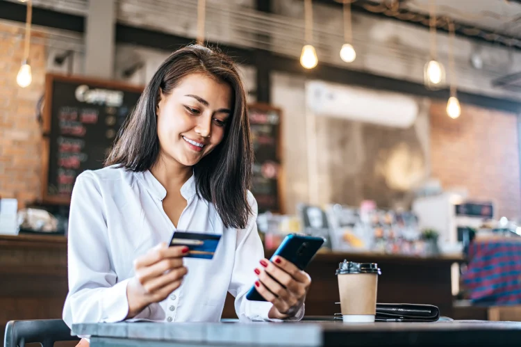 Pay for goods by credit card through a smartphone in a coffee shop